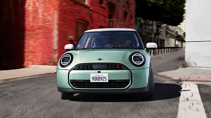 MINI Cooper on road front view MINI Cooper on road front view